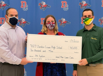 Weed Man Lawn Care Donates $10,000 to Dundee-Crown High School